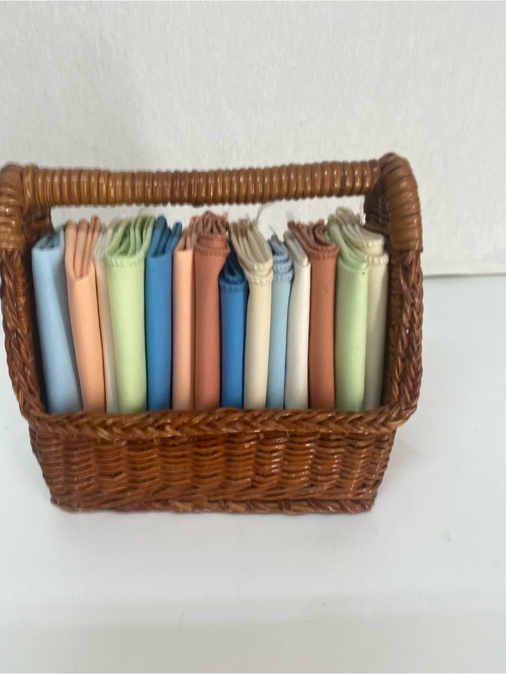 Wicker Basket Woven Rattan with Assorted Pastel Linens Cloths Storage Dainty